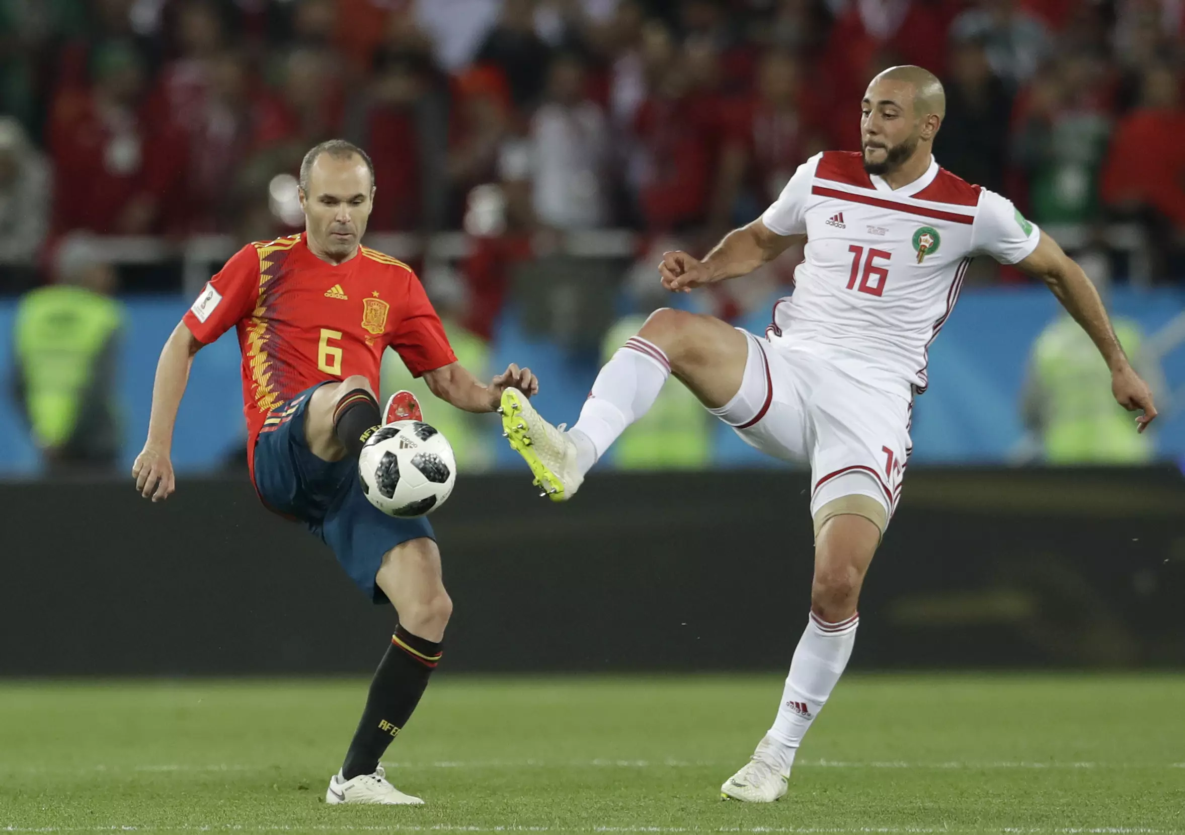 Amrabat challenging for the ball. Image: PA