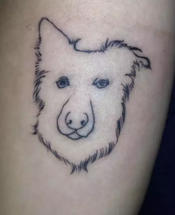 As well as the cocked-up nose, the dog looks like it's judging everyone.