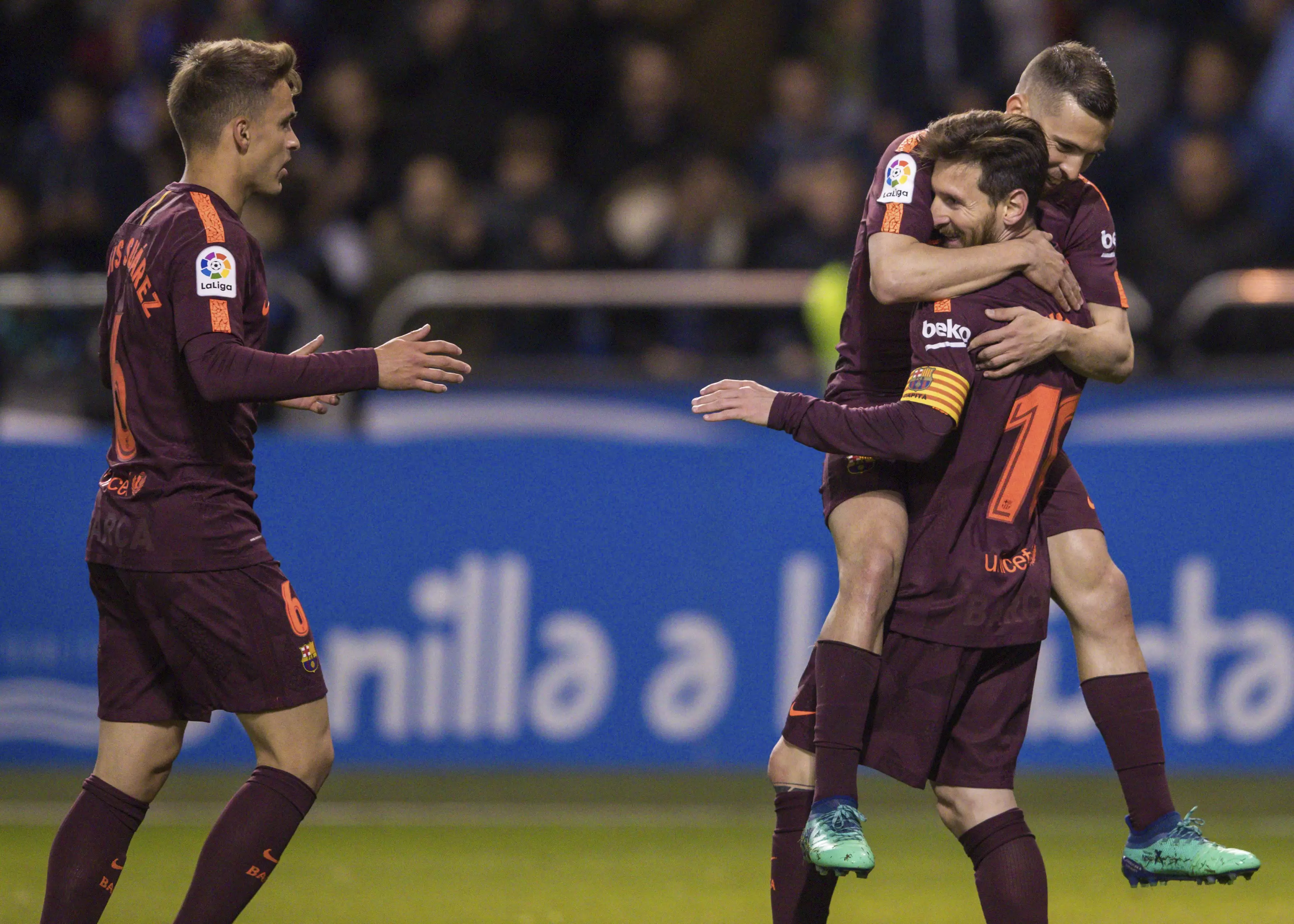 Messi is congratulated by his teammates. Image: PA