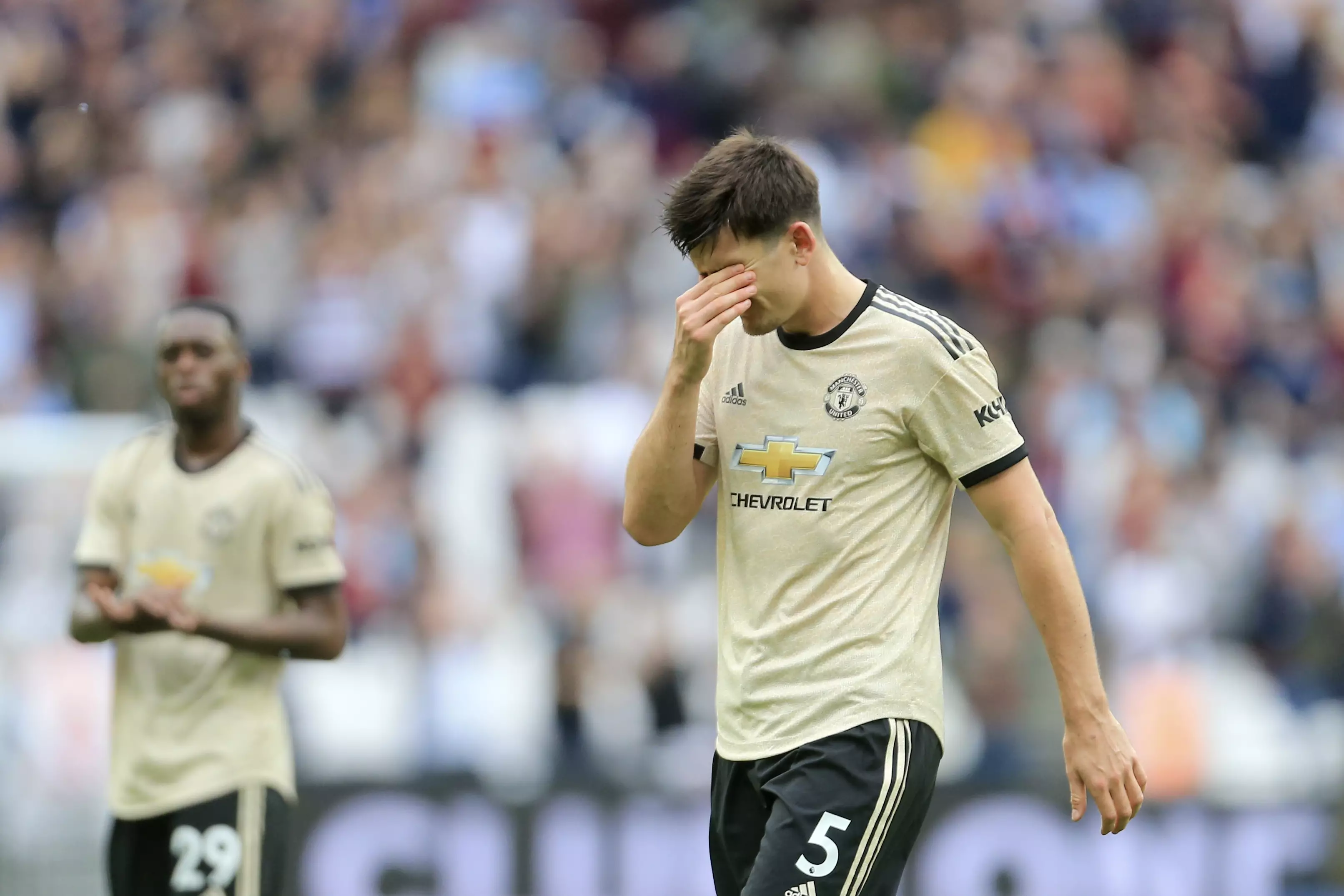Harry Maguire trying not to watch United's performance, fans will relate. Image: PA Images