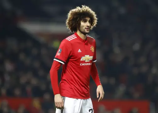 Fellaini in action for United against Derby County. Image: PA