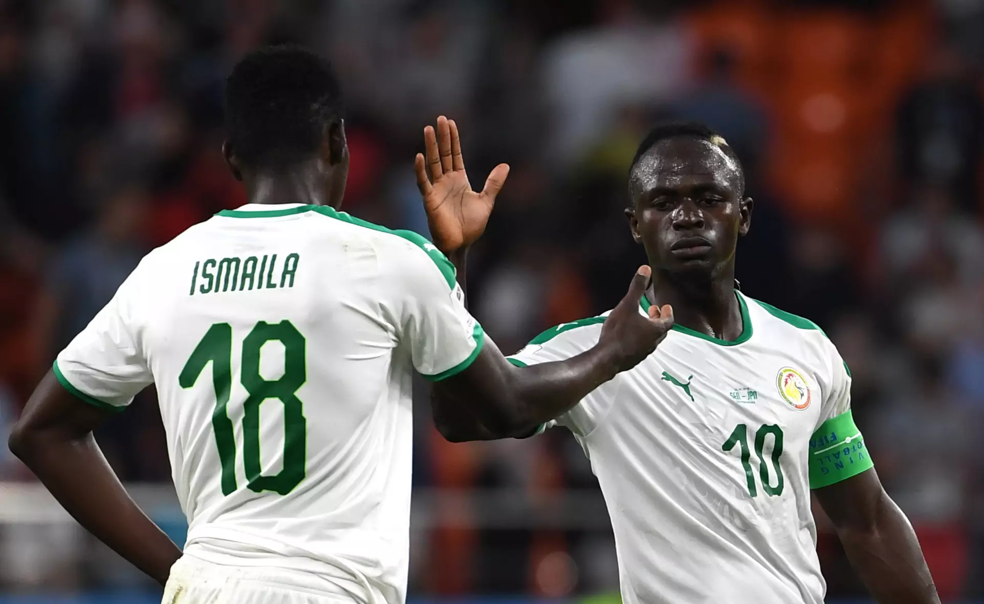 Senegal's Sadio Mane claps with teammate Ismaila Sarr after the 2018 FIFA World Cup Group H match between Japan and Senegal. Image: PA