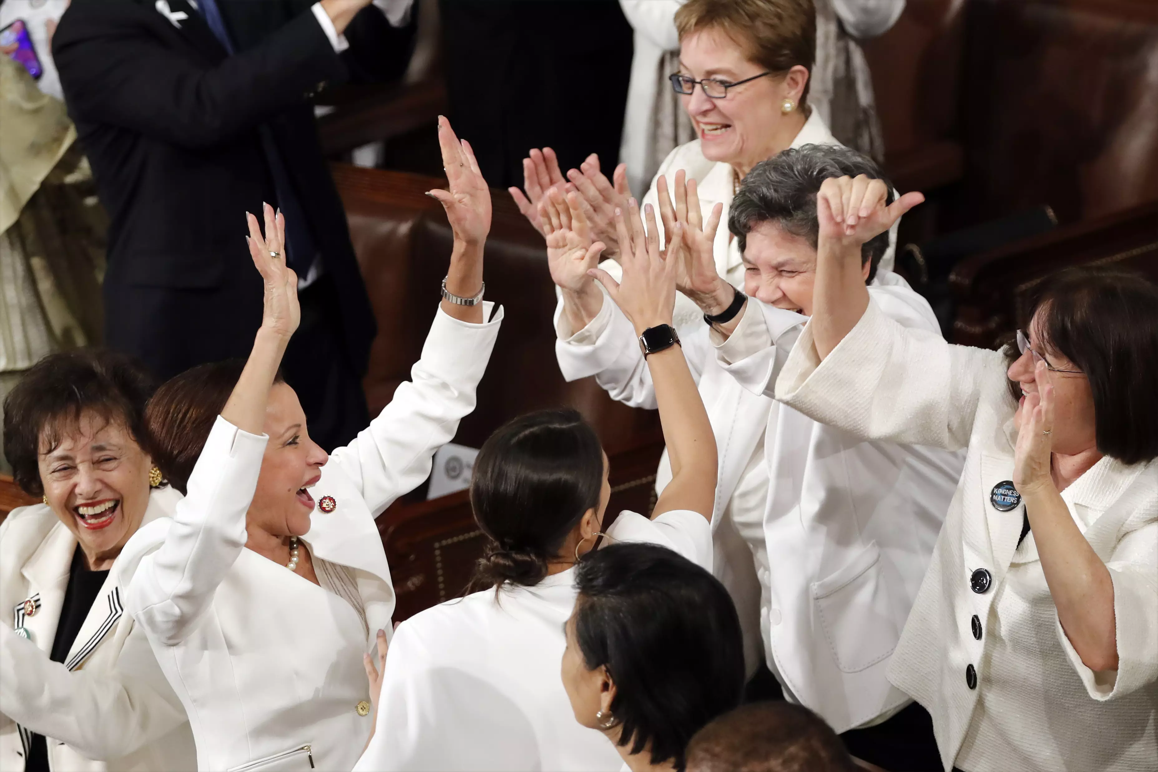 Members of Congress cheer after President Donald Trump acknowledges the record number of women in congress.