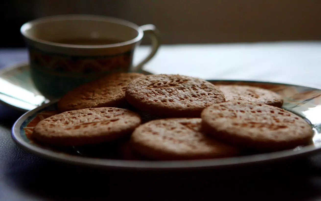 A plate of plain digestive biscuits.