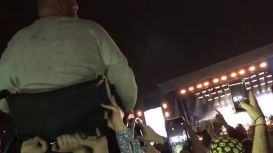 Incredible Moment Fans Lift Man In Wheelchair To Watch Liam Gallagher Sing 'Wonderwall'