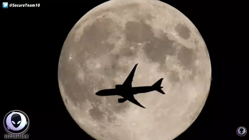 plane over moon