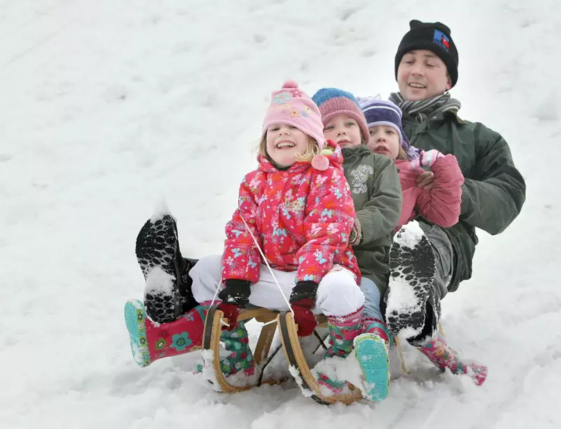 Families enjoying the snow in the Stormont estate in Belfast.