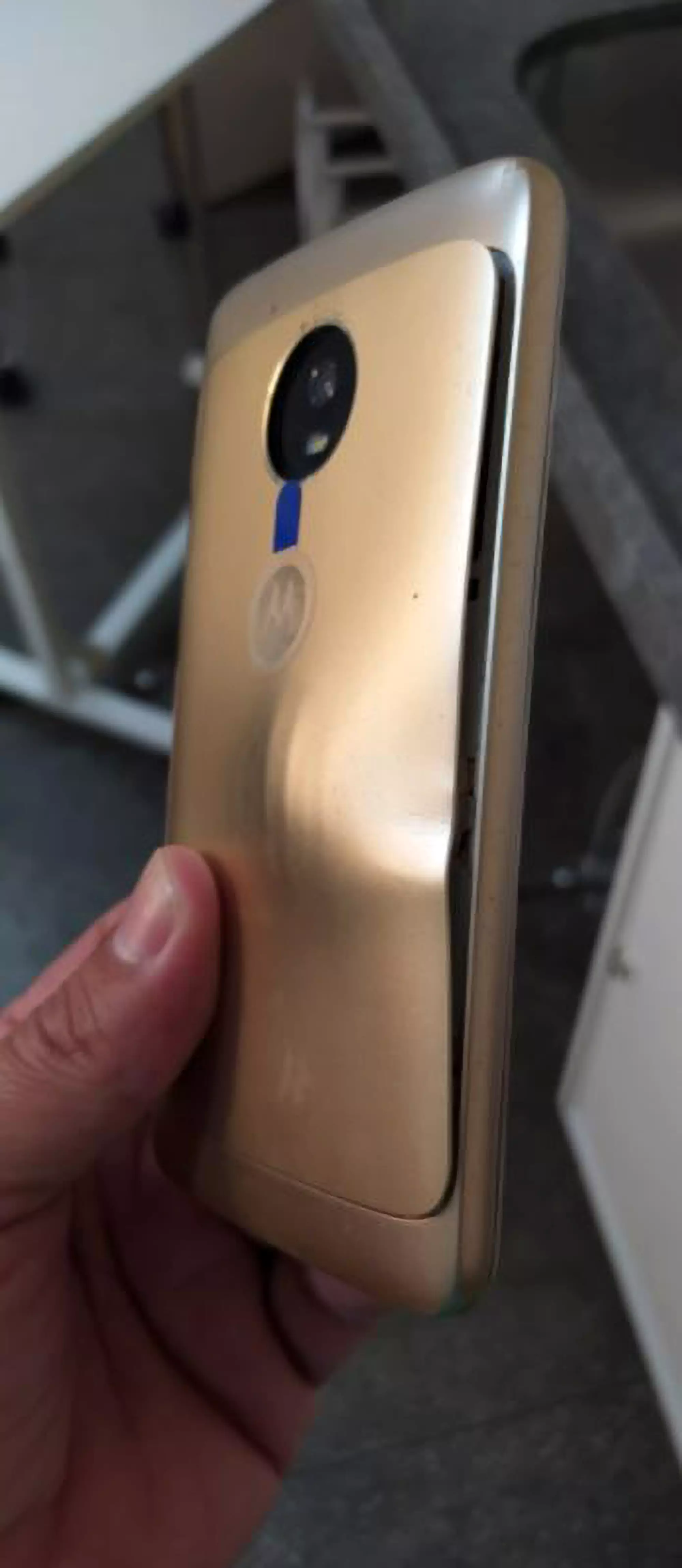 The bullet miraculously left the smartphone with nothing but a smashed screen and a visible dent.