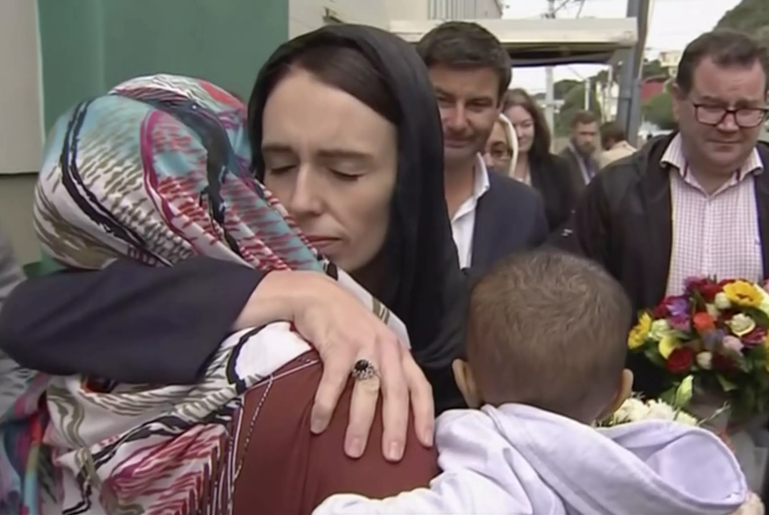 New Zealand Prime Minister Jacinda Ardern hugging worshipper outside Kilbirnie Mosque.