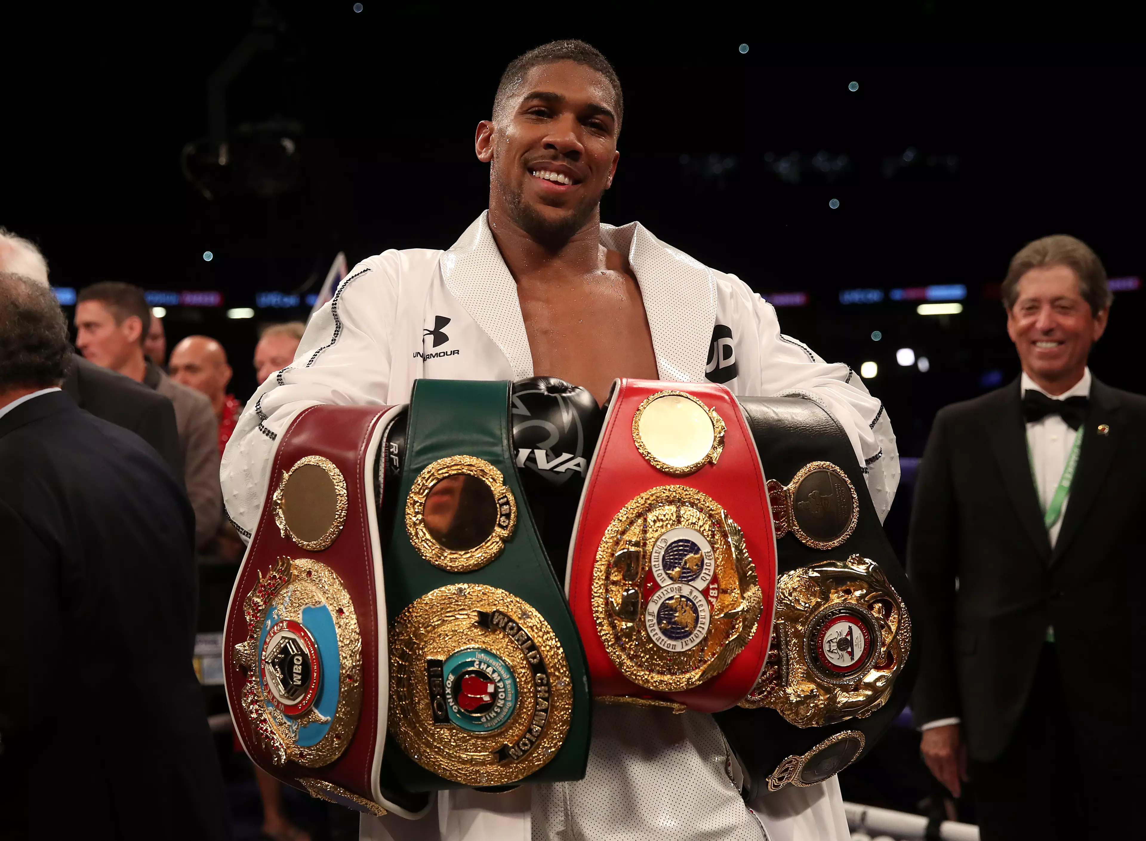 Joshua with his world titles. Image: PA