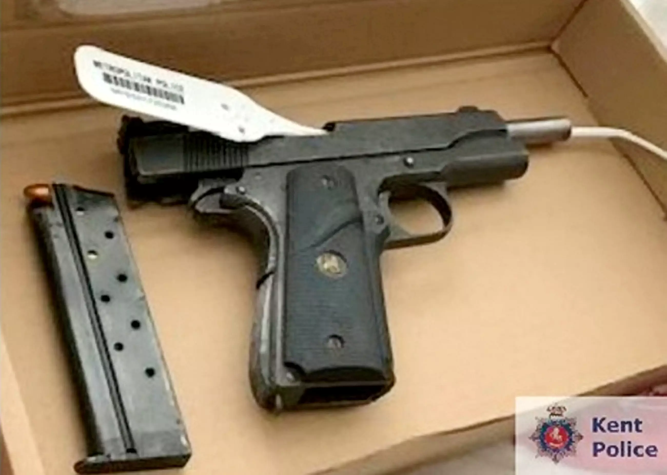 A loaded gun was discovered in his flat.