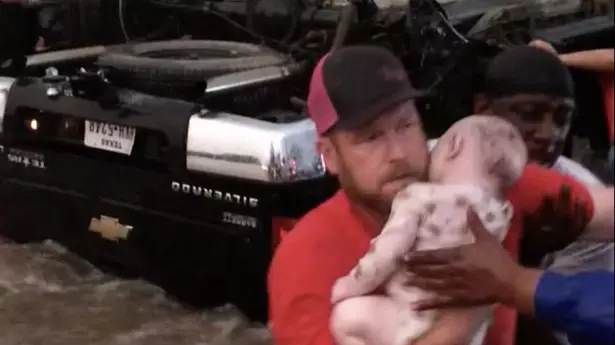Heroes Rescue Two Toddlers From Car Overturned By Floodwater