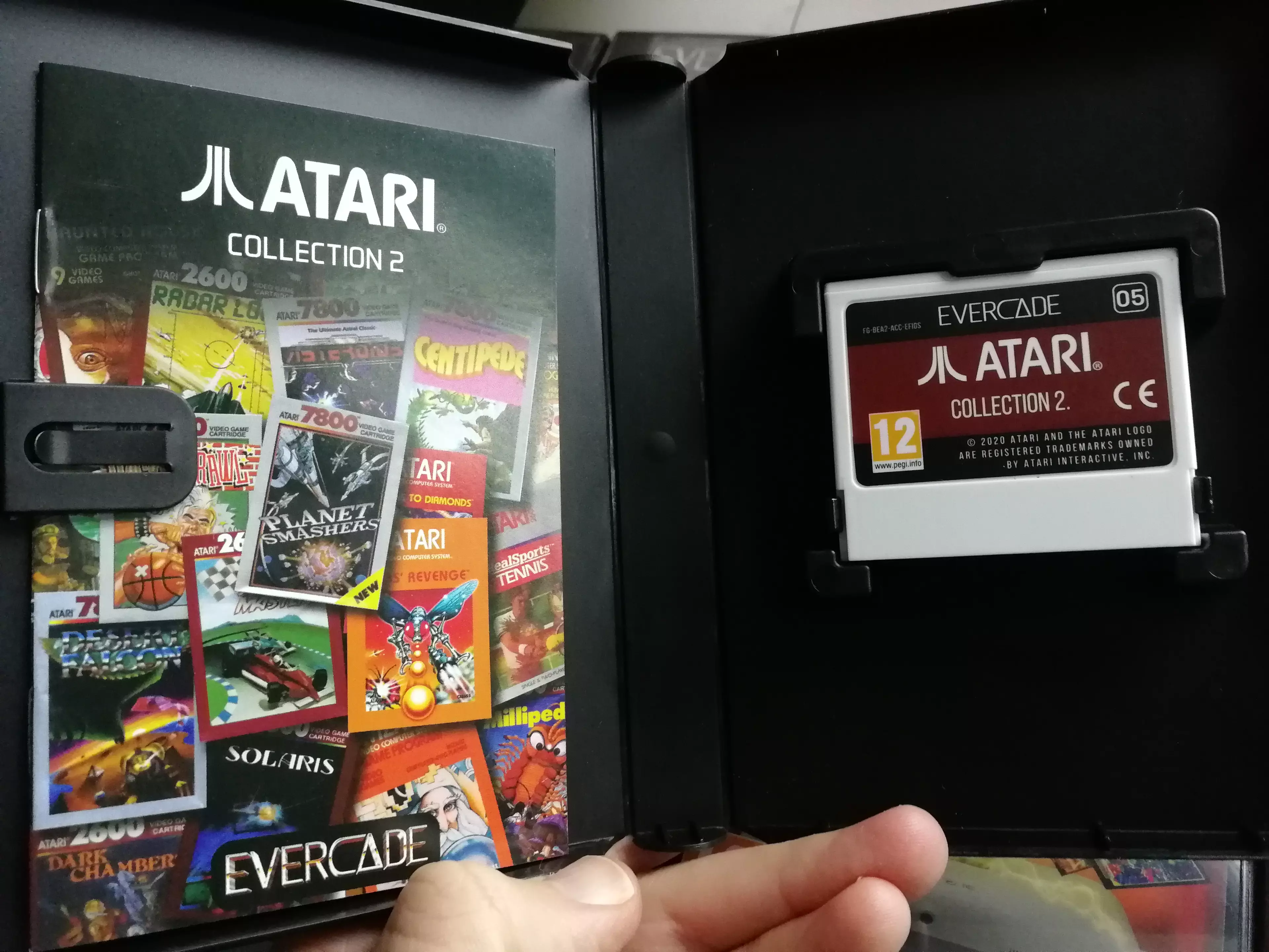 An Evercade cartridge and instruction manual /
