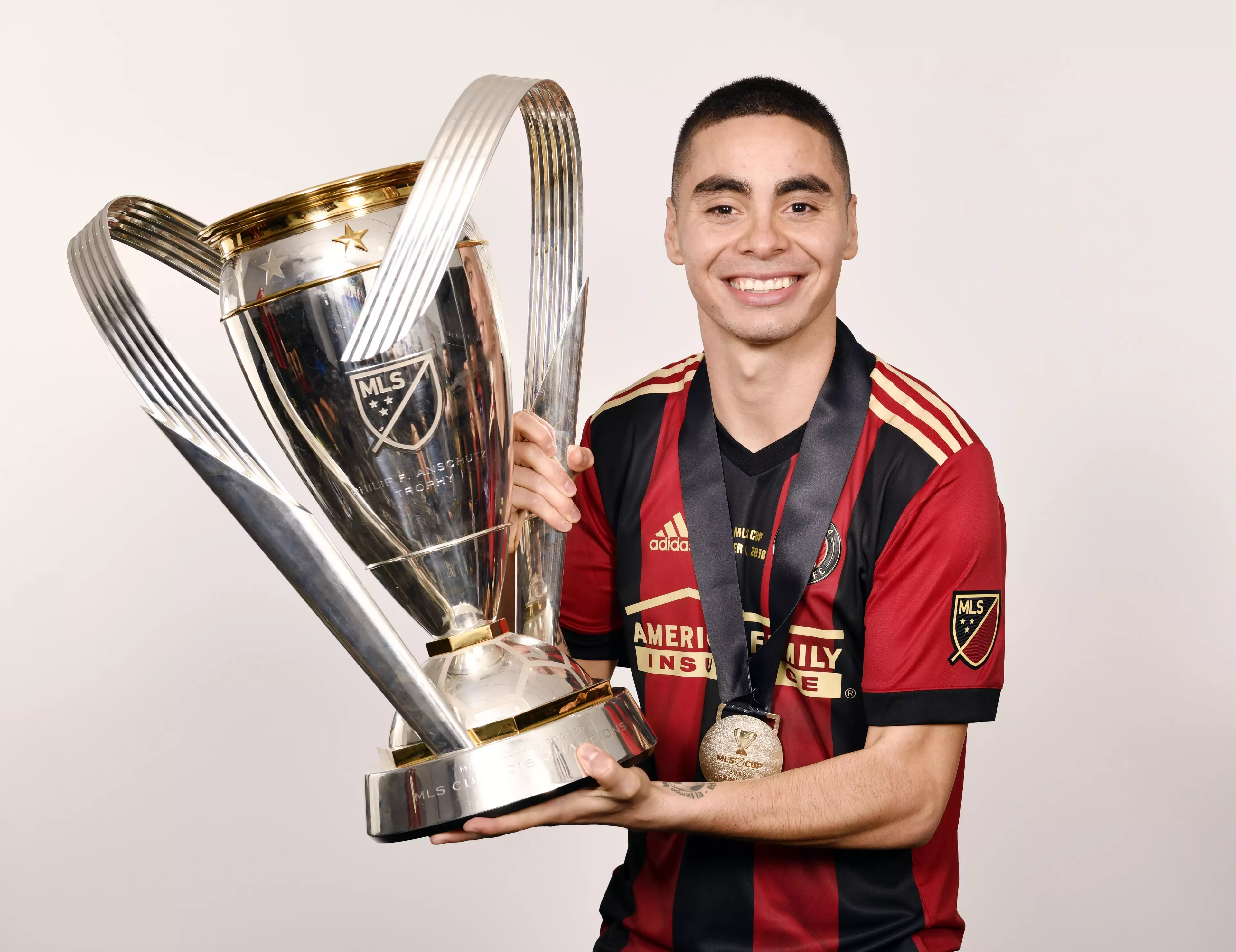 Almiron with the MLS Cup. Image: PA Images