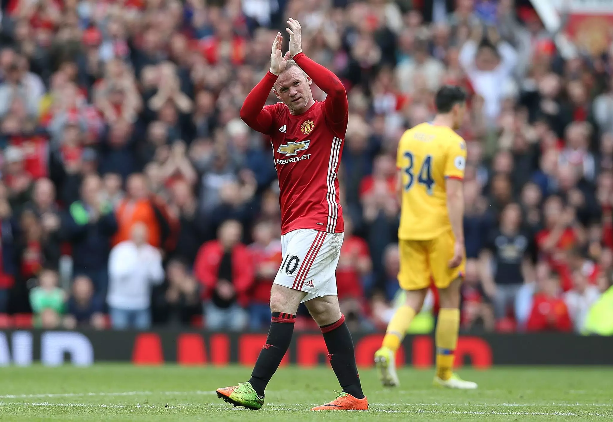 Rooney waves goodbye to United last season. Image: PA Images