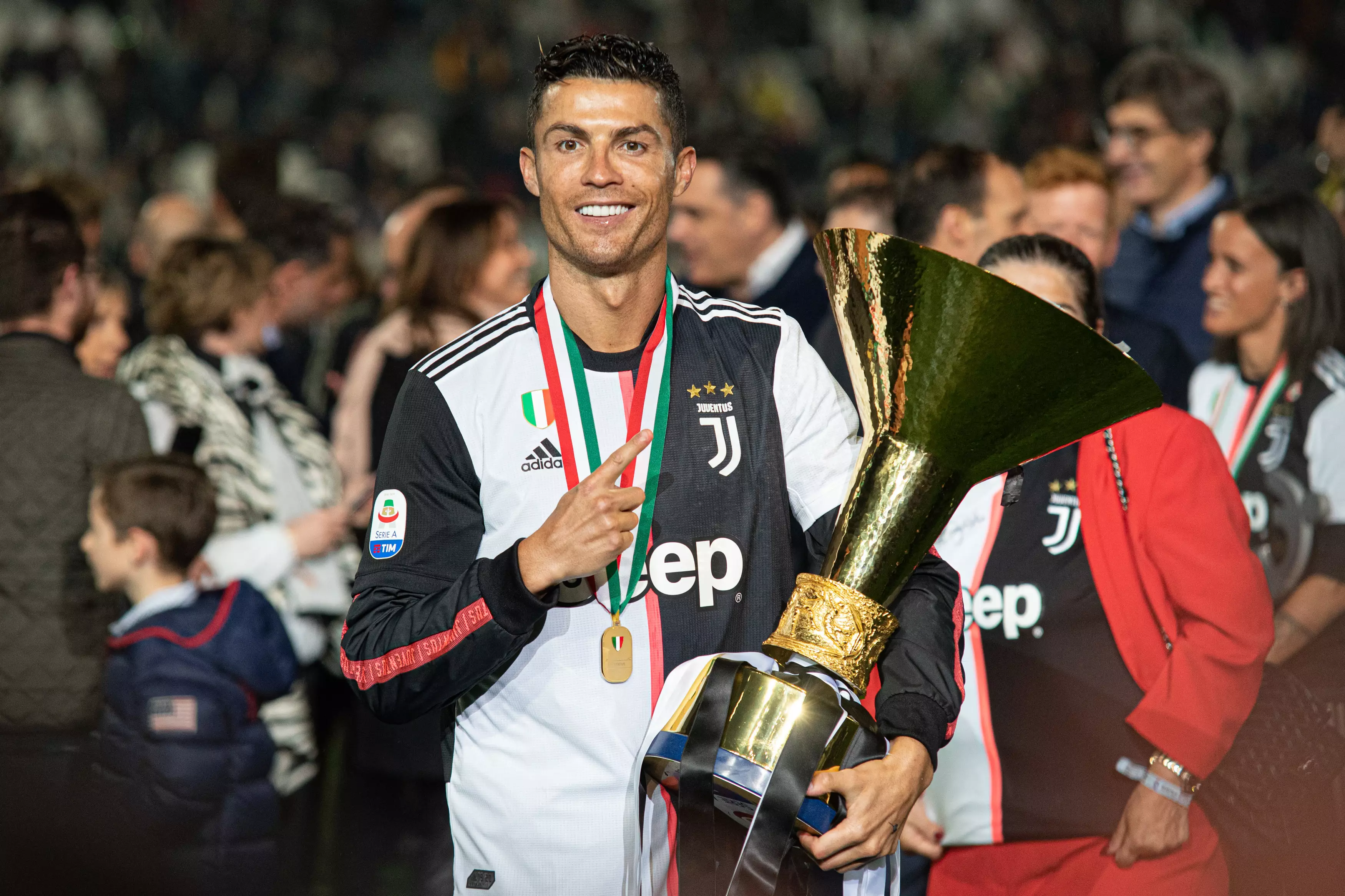 Ronaldo with the trophy and the controversial shirt. Image: PA Images