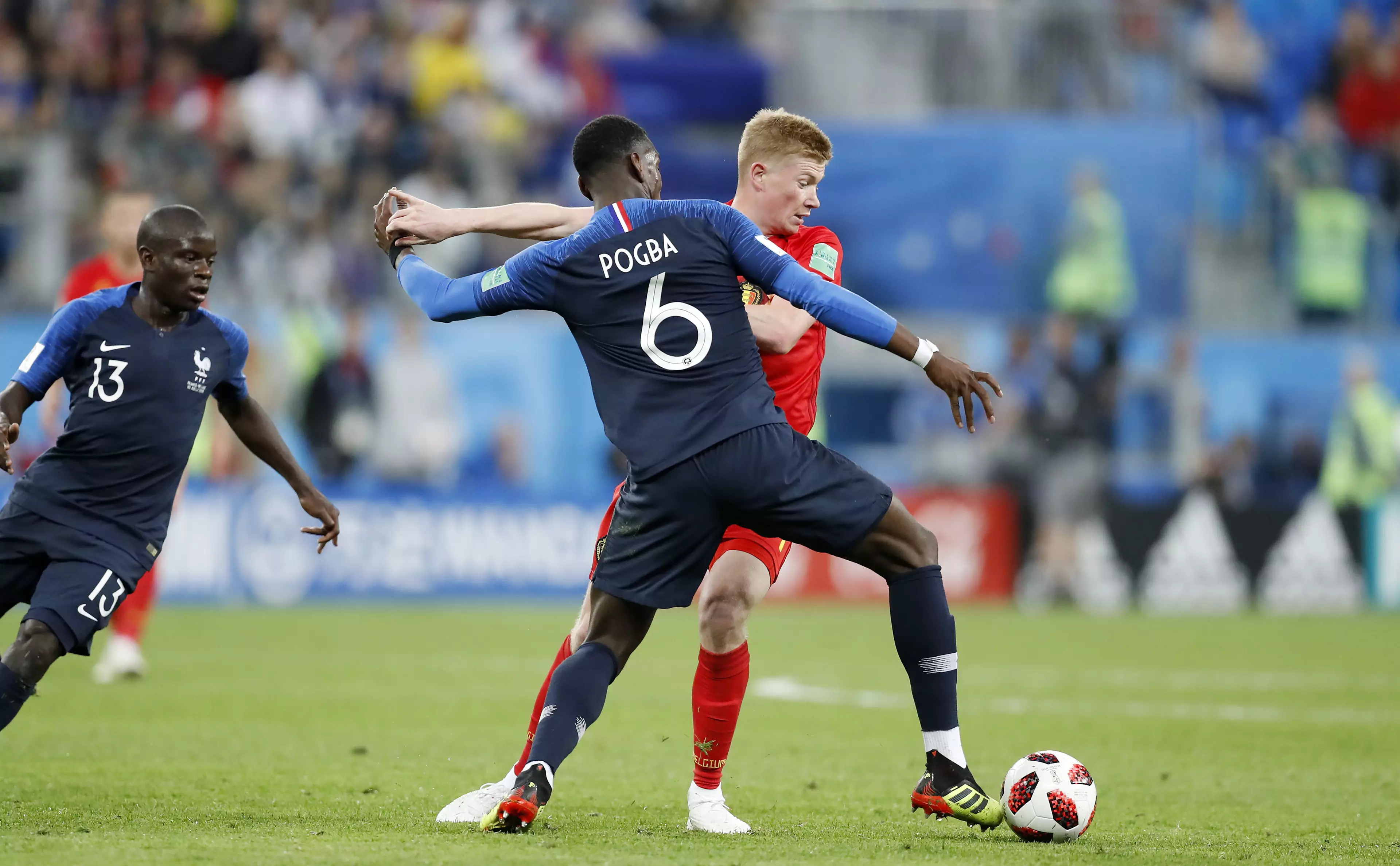 Pogba battling with De Bruyne for the ball. Image: PA
