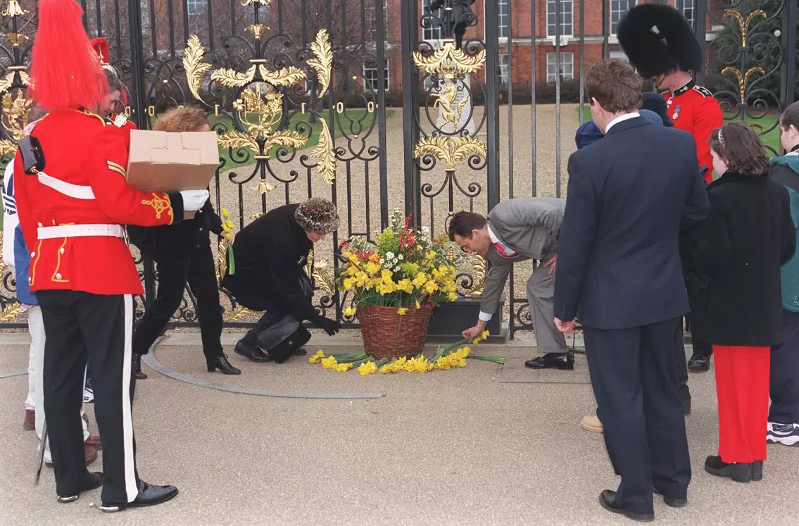 Paul Burrell laying flowers brought by children from a Cardiff hospital.