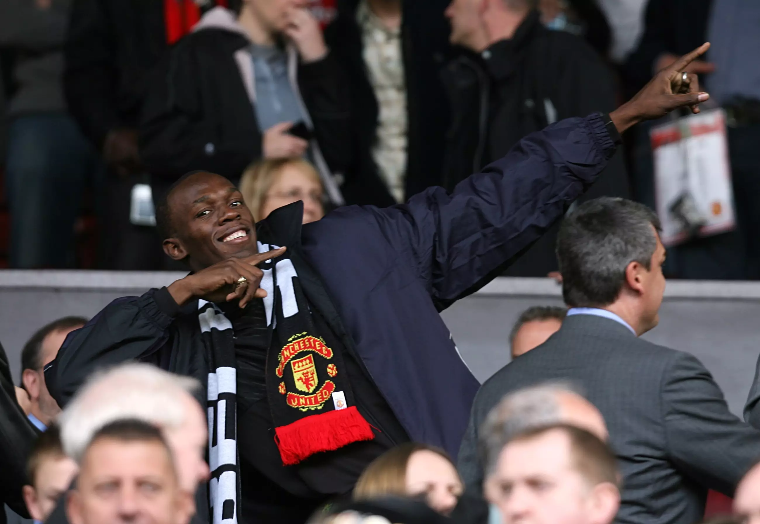 Bolt enjoying his team Manchester United playing at Old Trafford. Image: PA Images