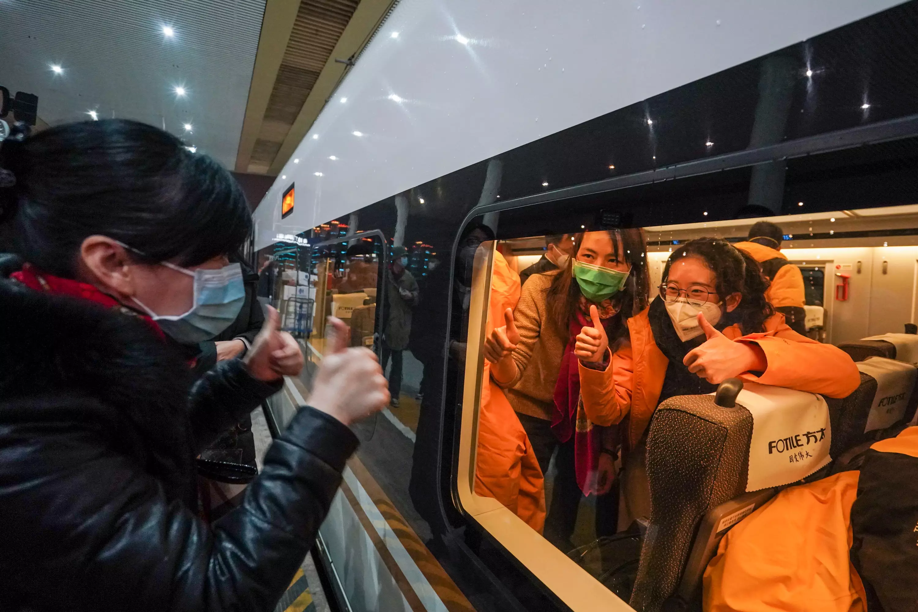 A relative encourages the medical staff at Nanjing South Railway Station on January 25 2020.