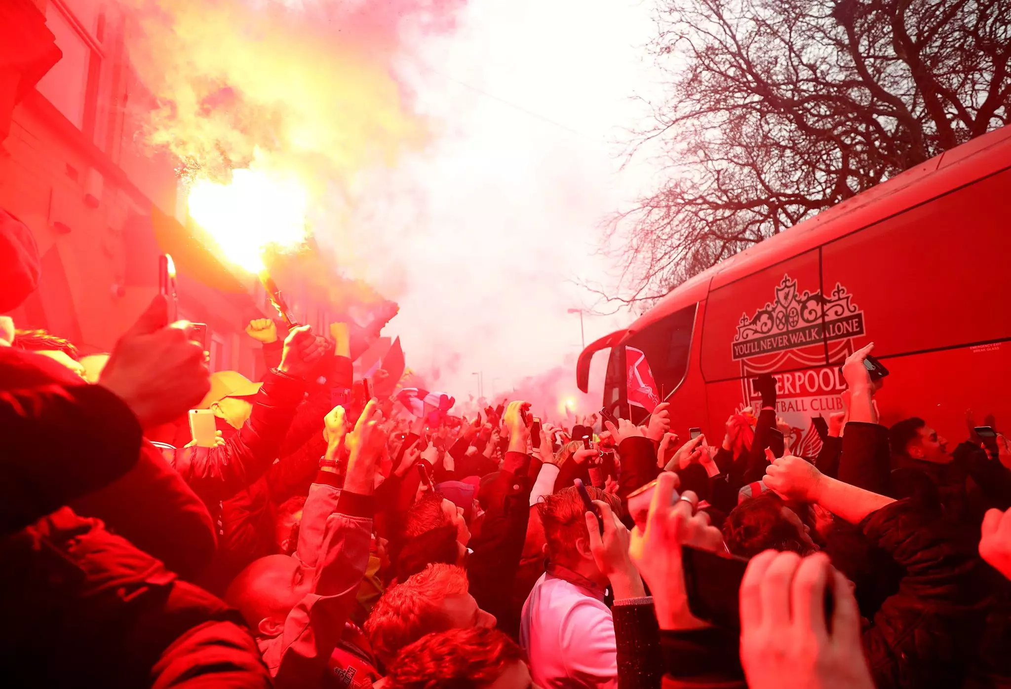 The Liverpool bus gets waved through. Image: PA Images