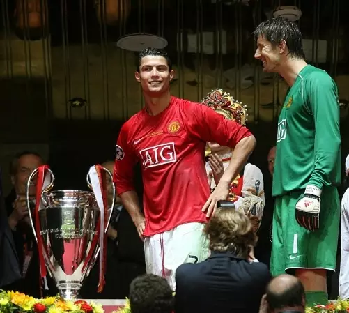 Ronaldo and van der sar next to the Champions League trophy. Image: PA