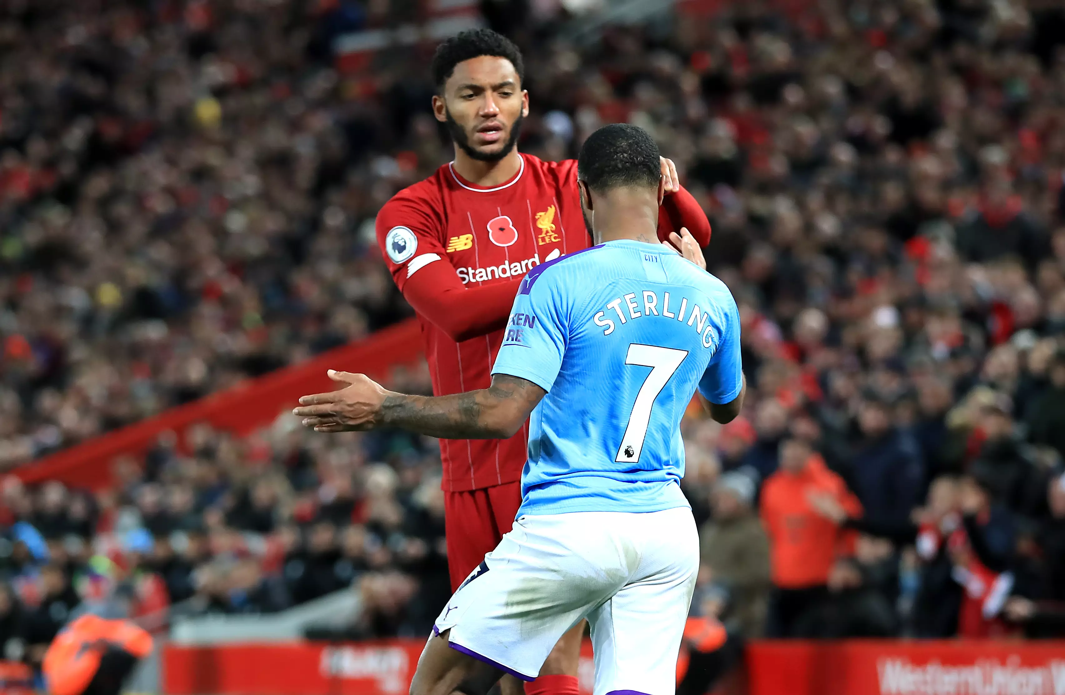 Sterling and Gomez clash during the big game on Sunday. Image: PA Images