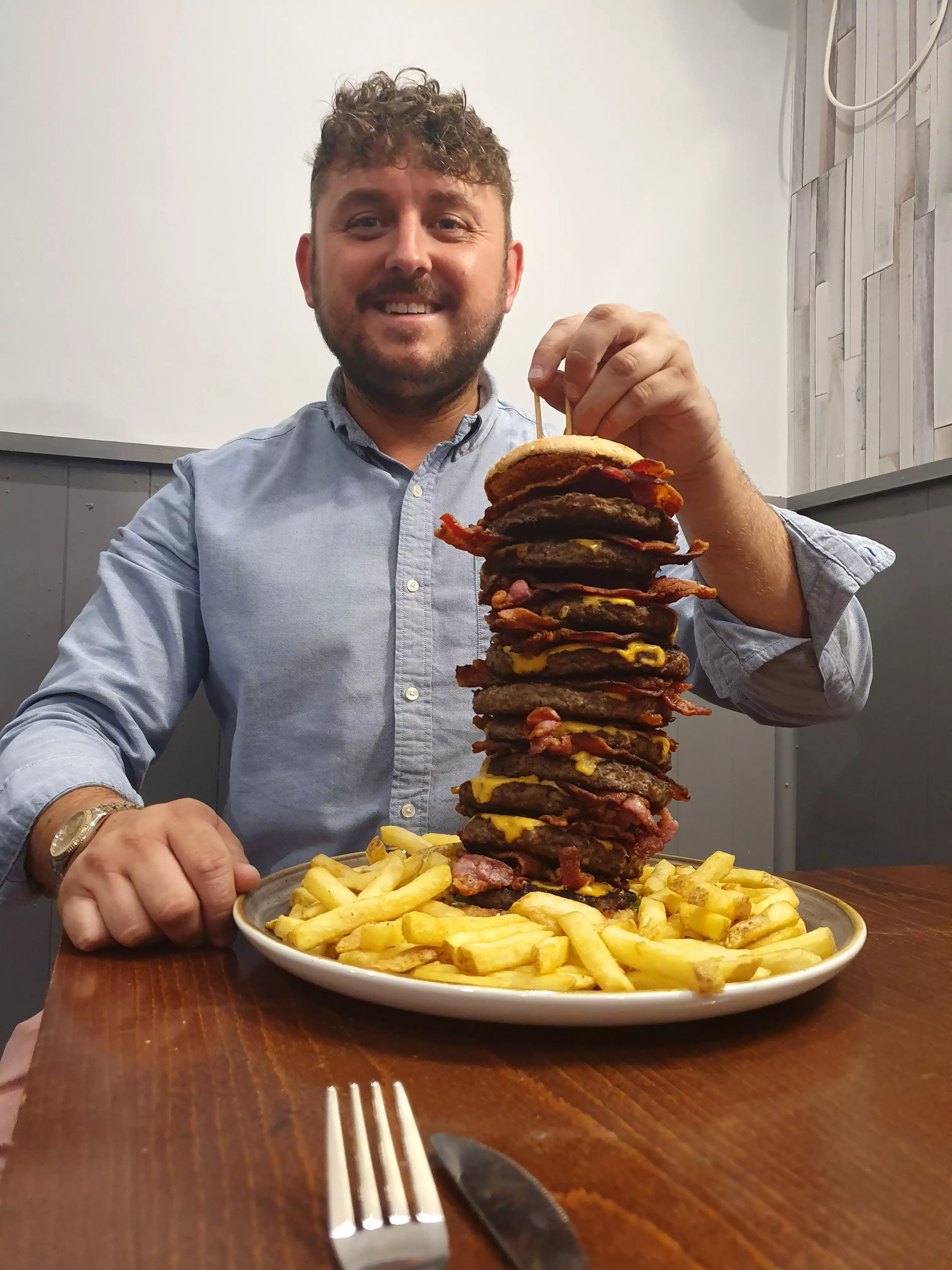 Pub owner Craig Harker with that monstrous burger.