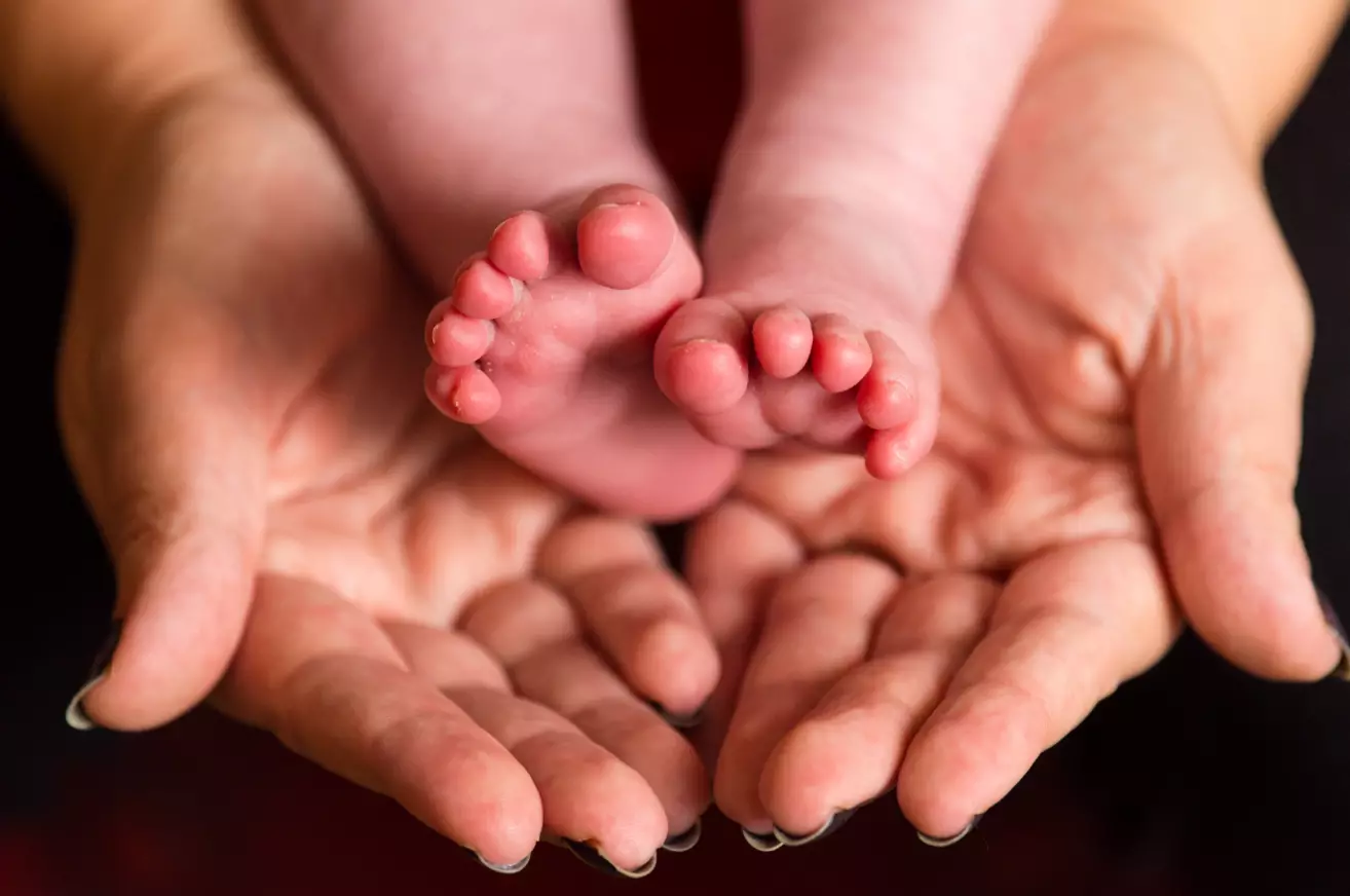 Enjoy this heartwarming stock image of some baby's feet.