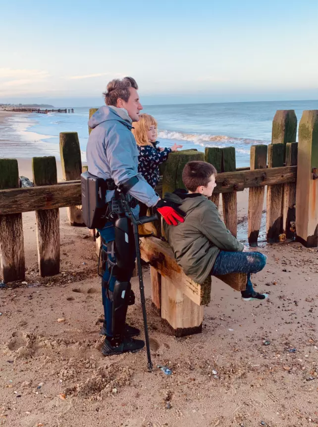 Simon on the sands with his son and daughter.