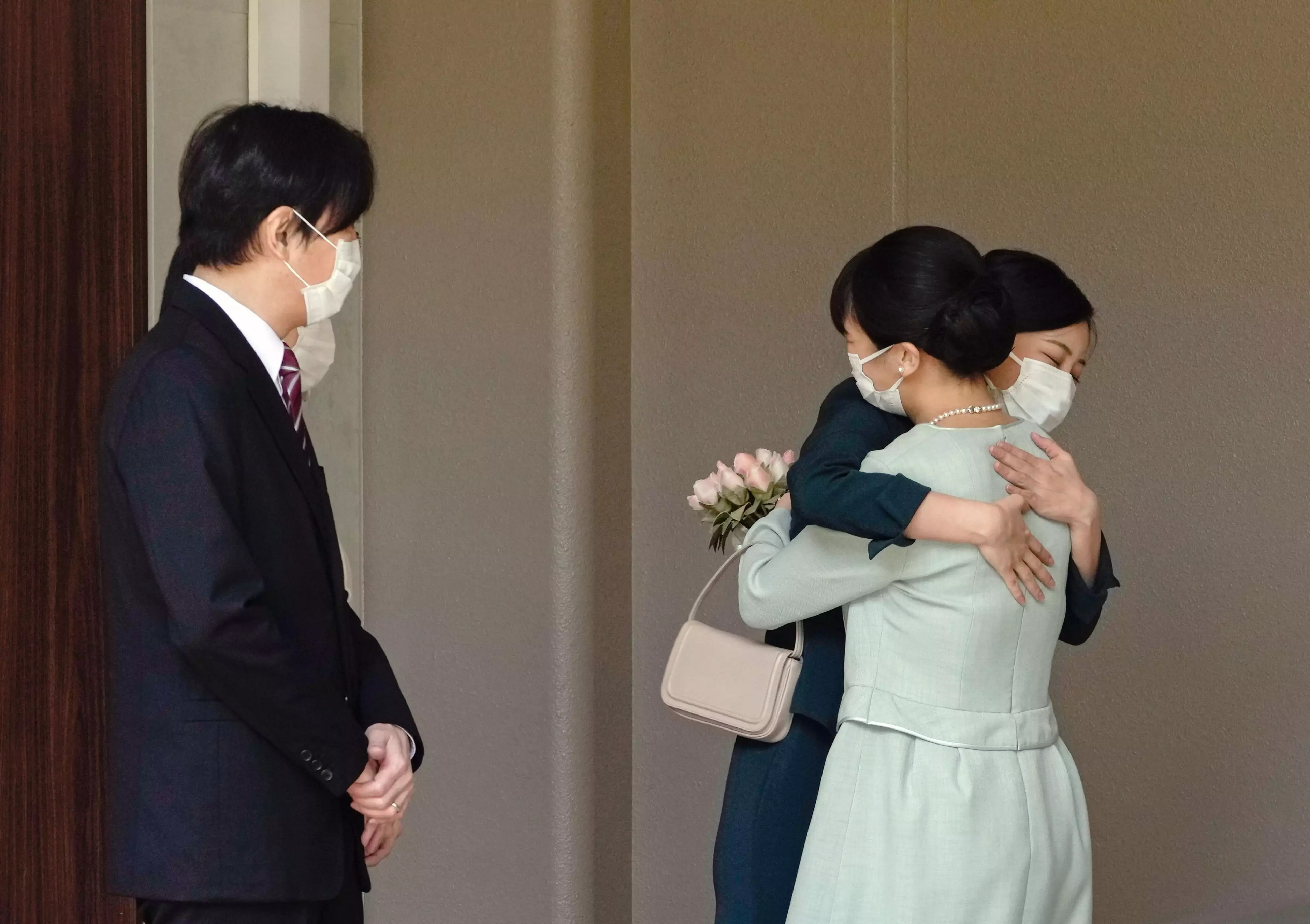 Princess Mako hugs her sister as she leaves the royal household.