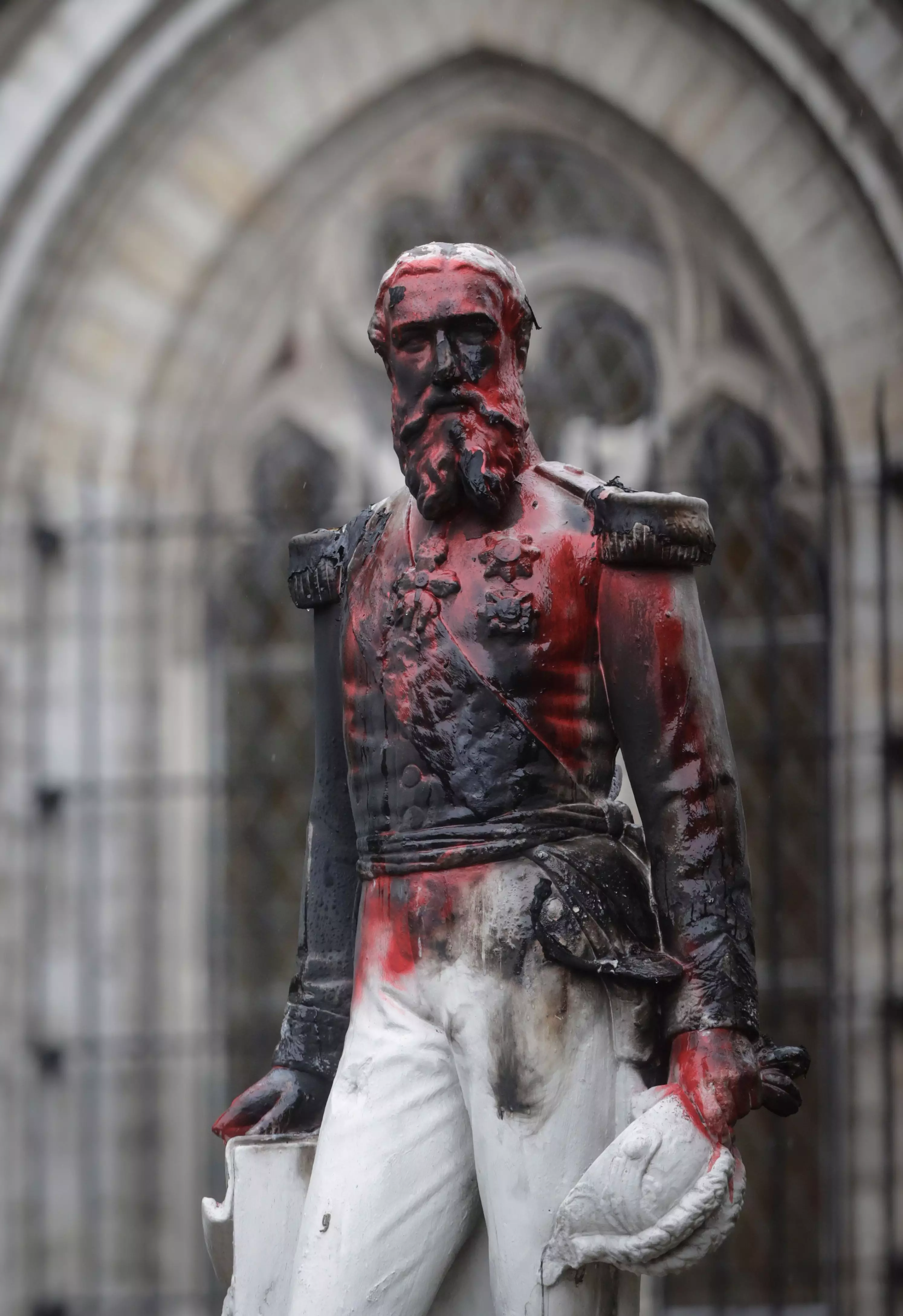 The Leopold II statue in Antwerp had been set on fire and covered in red paint.