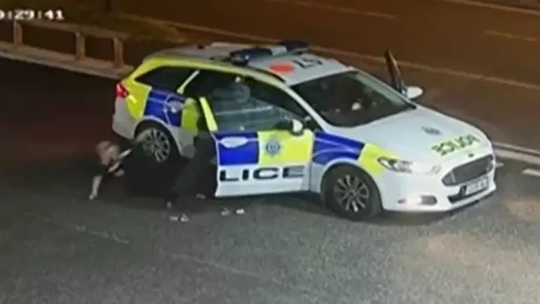 Armed Robber Throws Police Officer Out Of Car In Escape Bid