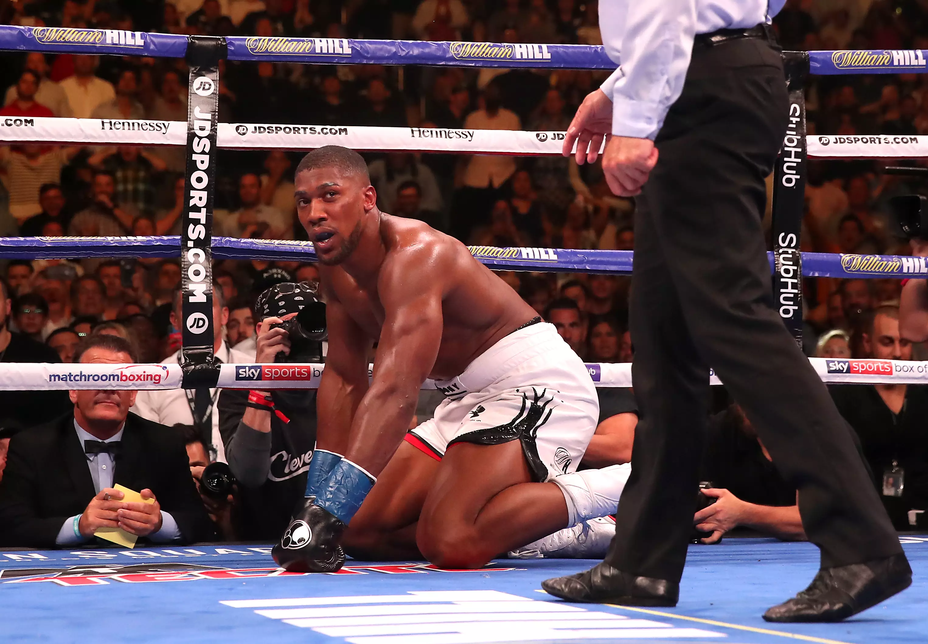 Joshua being counted down during the bout by referee Mike Griffin (Image