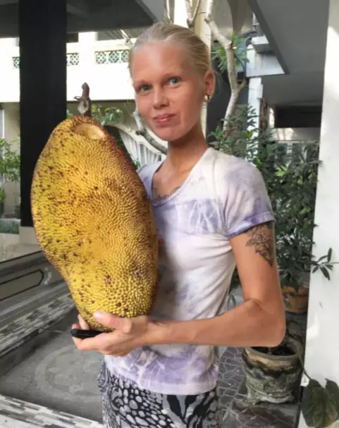 Daniella with a durian fruit.