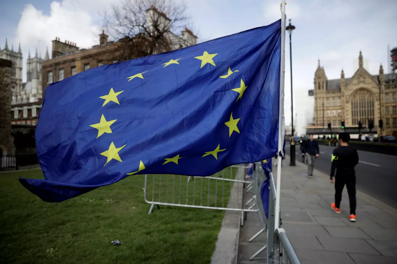 A European Union flag outside the Houses of Parliament.