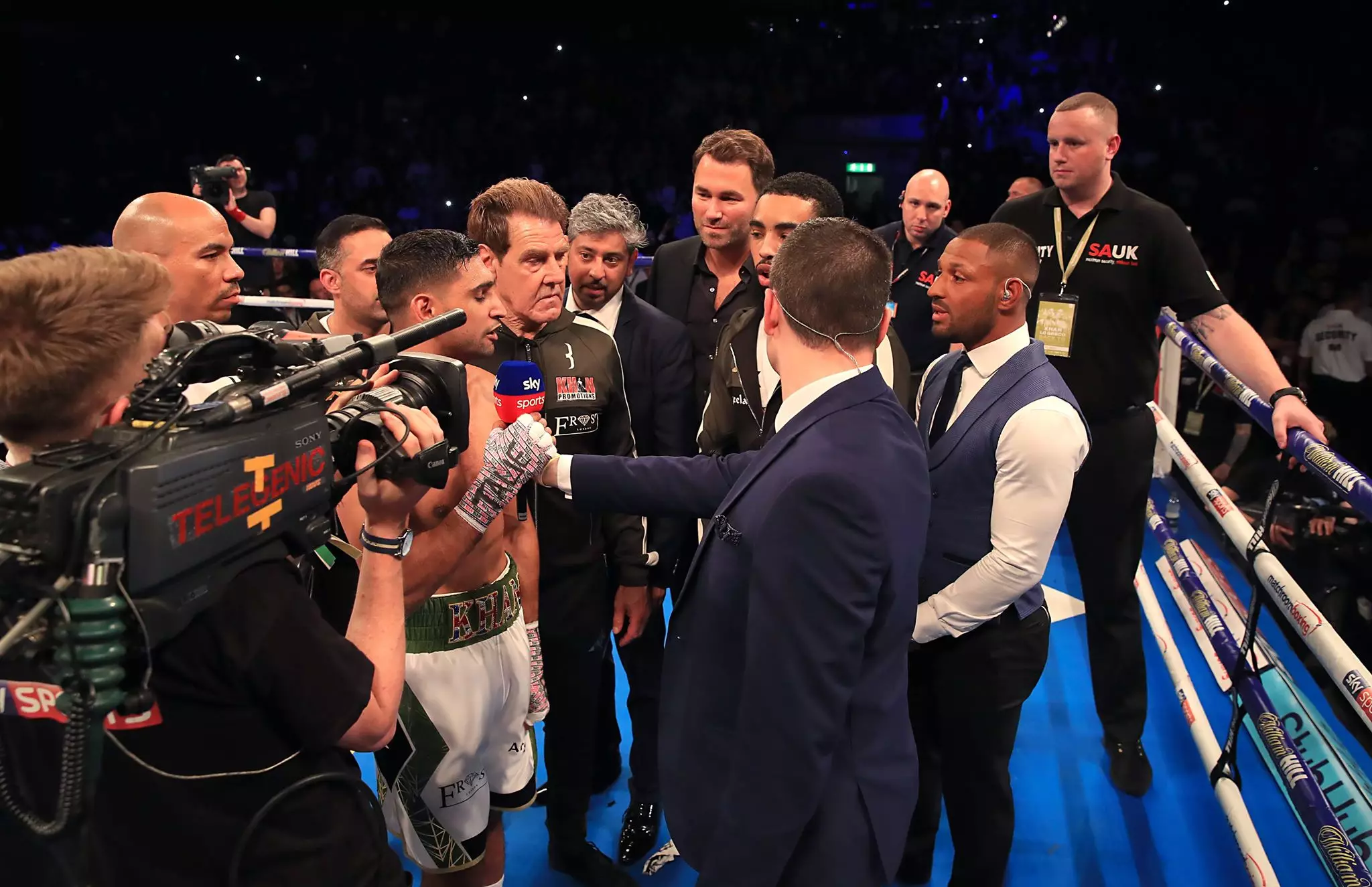 Brook enters the ring and sparks a war of words with Khan. Image: PA