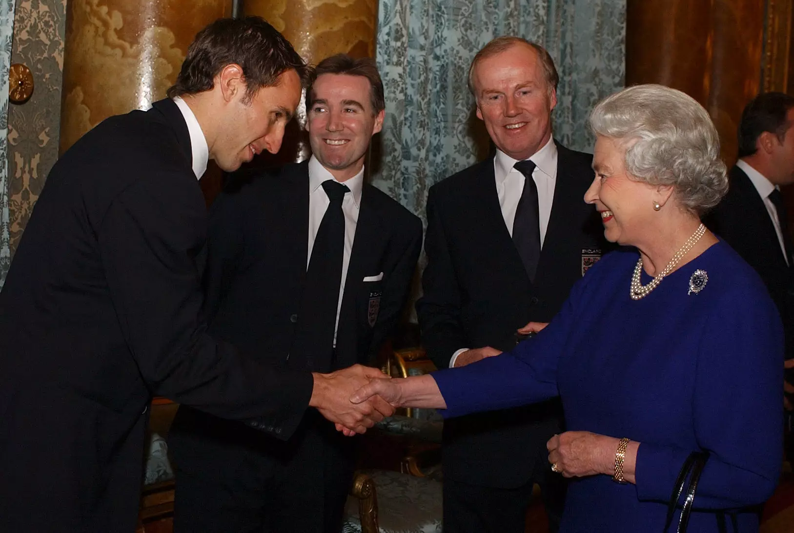 The Queen and a young Gareth Southgate back in 2002.