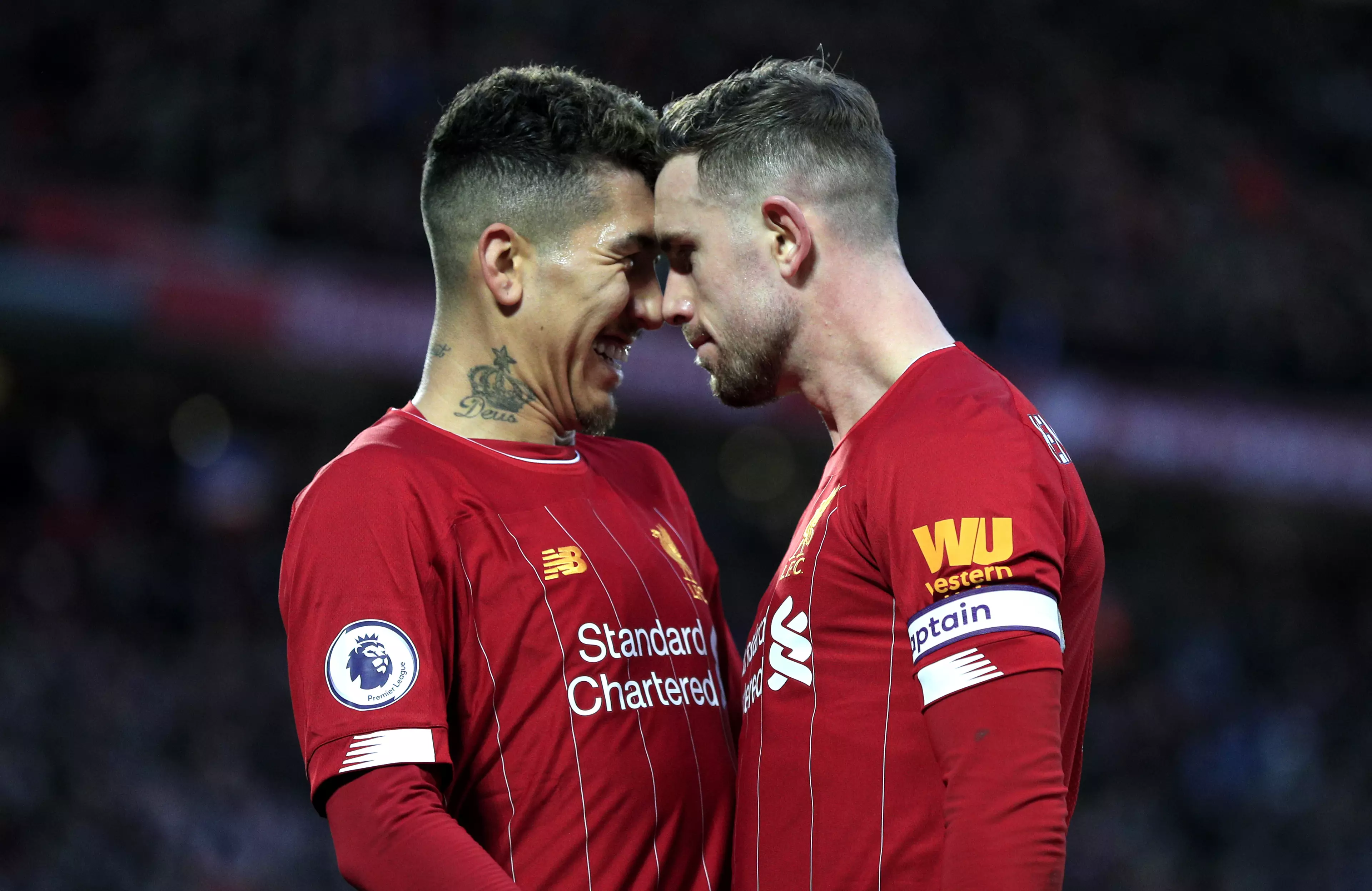 Henderson celebrates with Roberto Firmino during the 4-0 win over Southampton. (Image