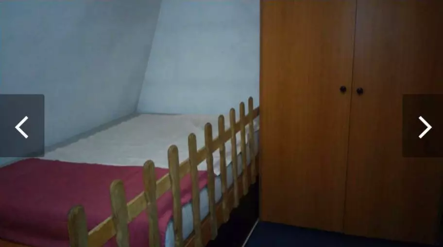 The bed looks like it has a fence around it.