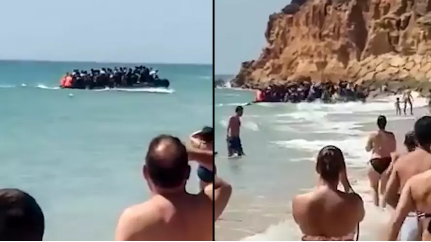 Shocked Tourists Watch 50 Migrants On Packed Boat Storm Spanish Beach
