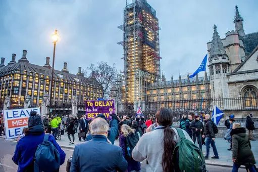Protesters rally outside parliament in Westminster.