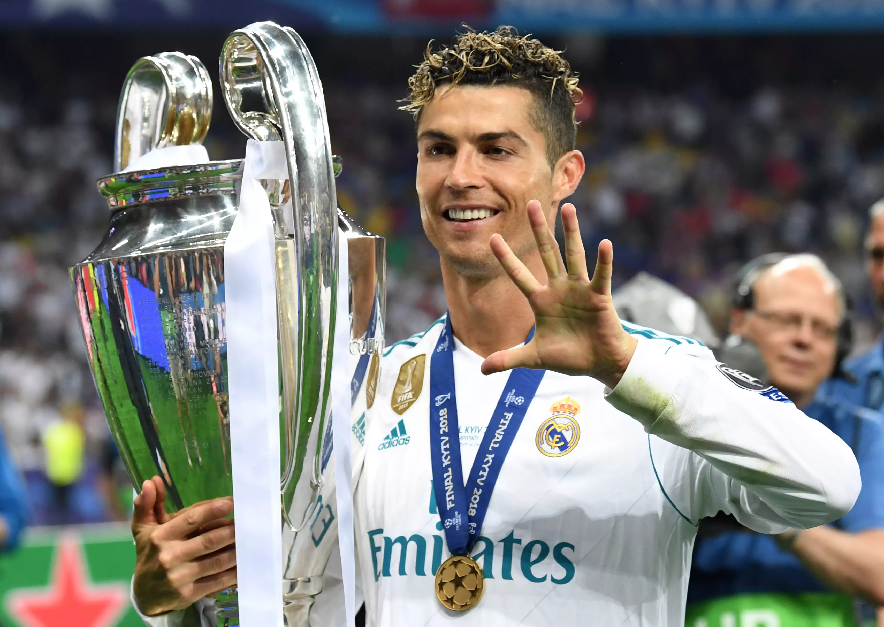 Ronaldo poses with the Champions League trophy. Image: PA