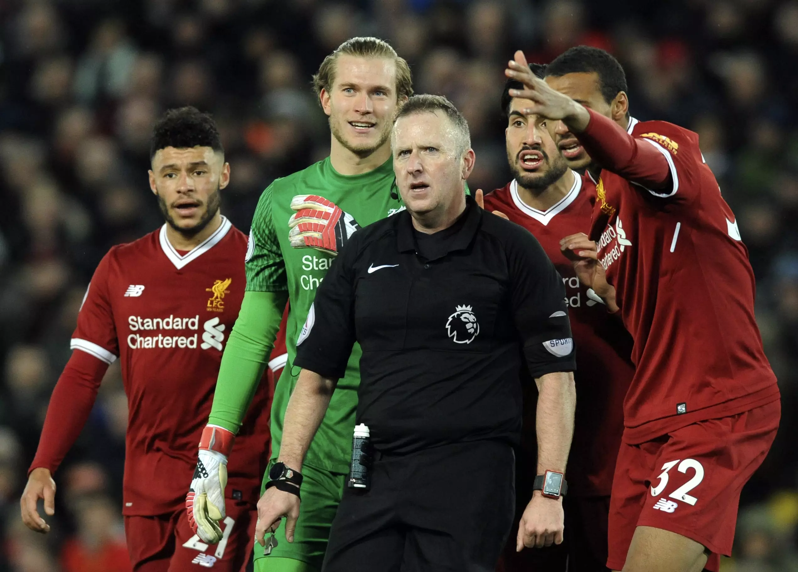 Liverpool players argue over the awarding of the second penalty. Image: PA Images.
