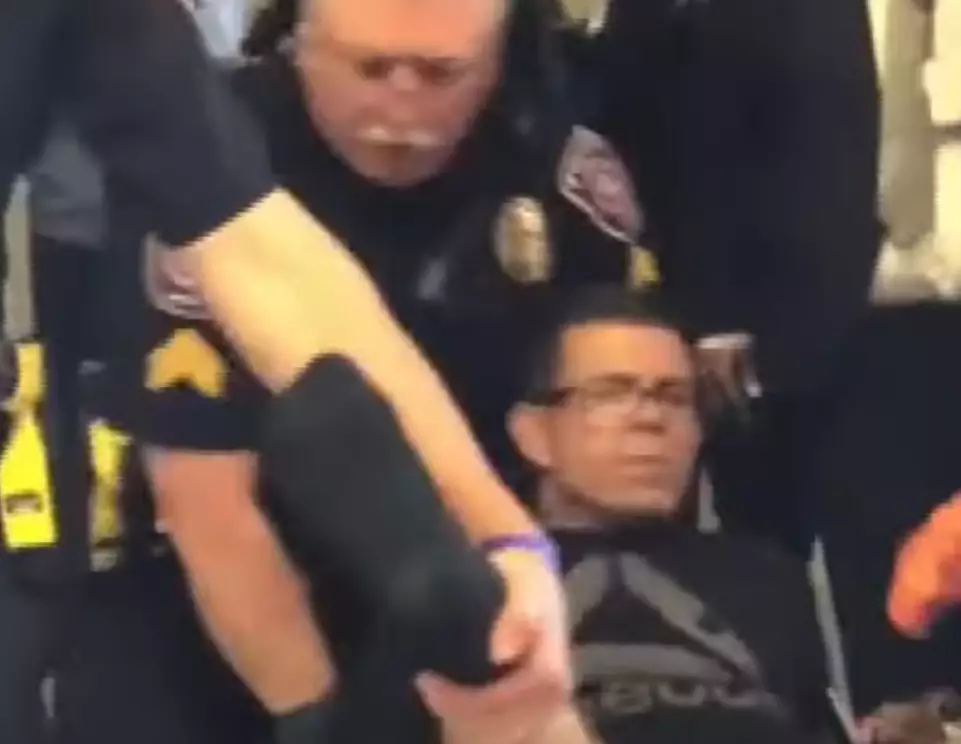 He was handcuffed to a wheelchair by airport police.