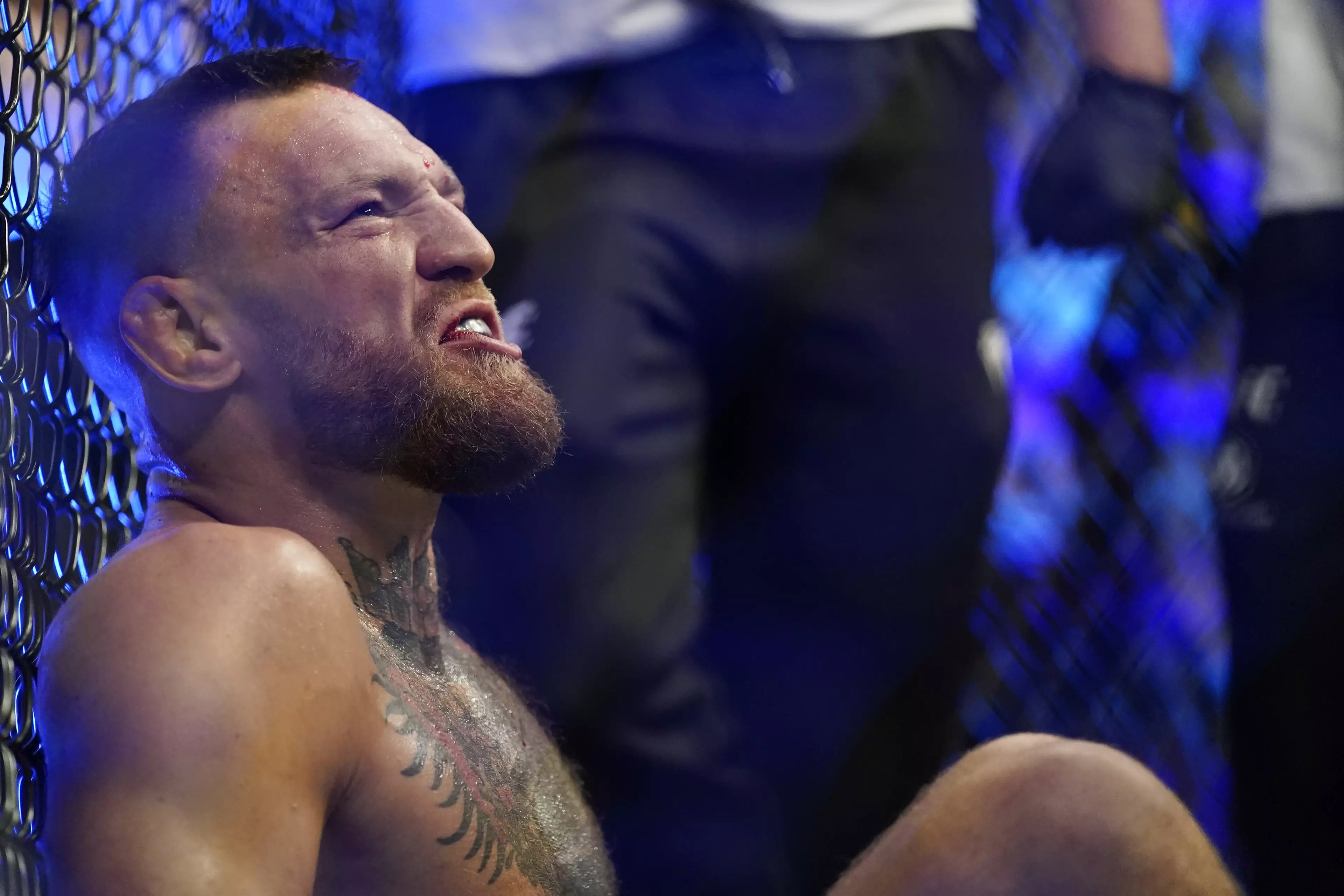 McGregor continued to shout insults whilst sat on the octagon floor. Image: PA Images