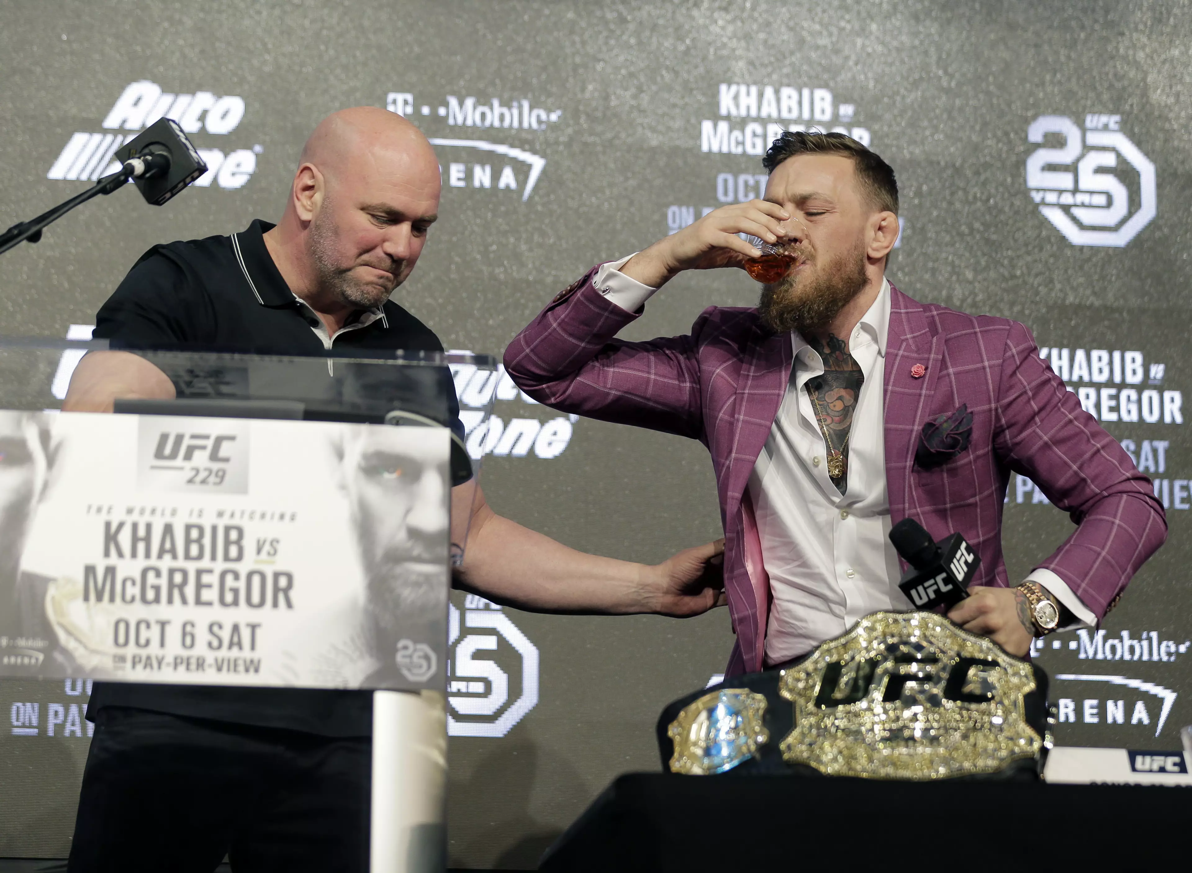 McGregor has a sip of his whiskey. Image: PA