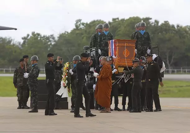 The body of Saman Gunan is carried during a repatriation and religious rites ceremony in Thailand.