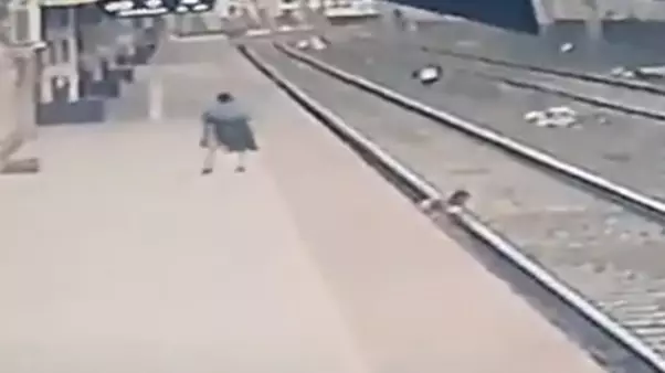 Man Saves Child's Life From Oncoming Train In Heart-Stopping Video