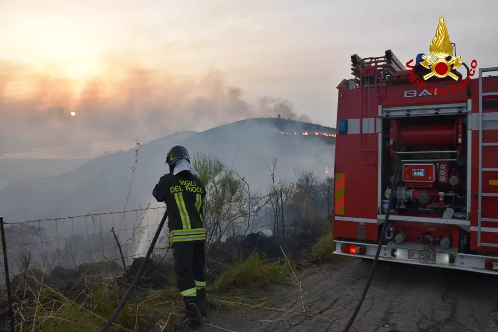 A firefighter battles against wildfires on Sicily Island.